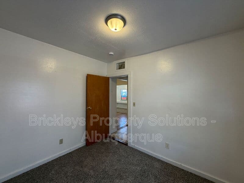 4-bedroom 2-bath home at 313 Cornell Drive SE Unit A for $1,600/mo managed by Brickleys Property Solutions Albuquerque — photo 16 of 27