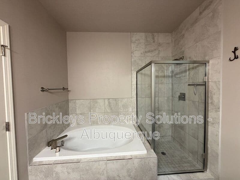 4-bedroom 2.5-bath home at 7420 Tangerine Court NE for $2,450/mo managed by Brickleys Property Solutions Albuquerque — photo 27 of 39