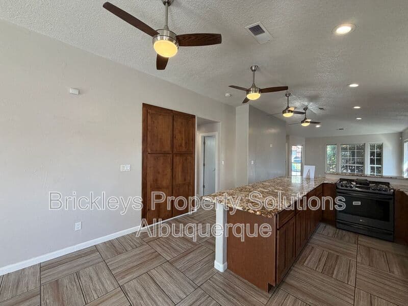 3-bedroom 2-bath home at 7024 Westford Pl NW for $2,200/mo managed by Brickleys Property Solutions Albuquerque — photo 8 of 33