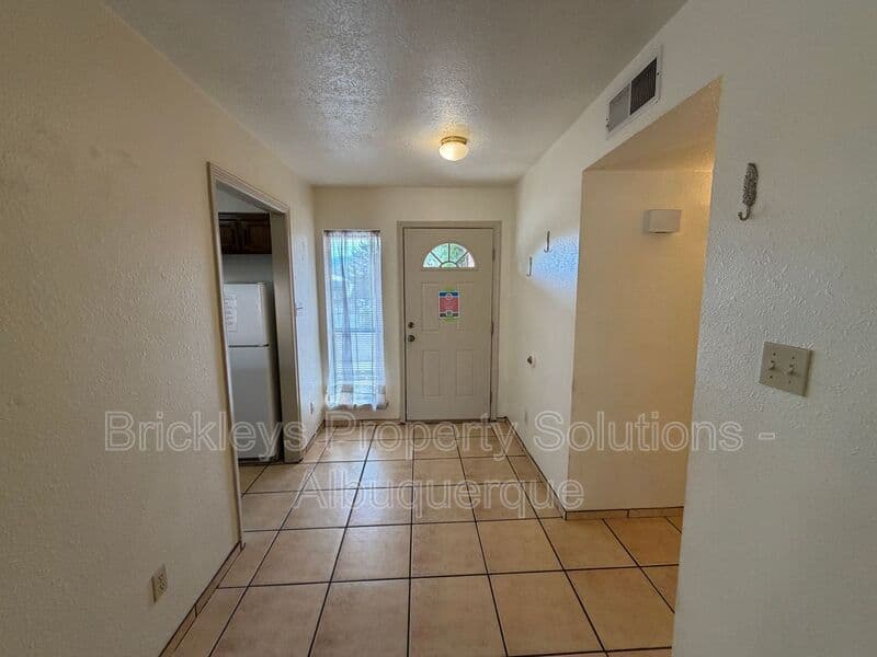 3-bedroom 2-bath home at 9937 Clearwater St. NW for $1,900/mo managed by Brickleys Property Solutions Albuquerque — photo 4 of 27