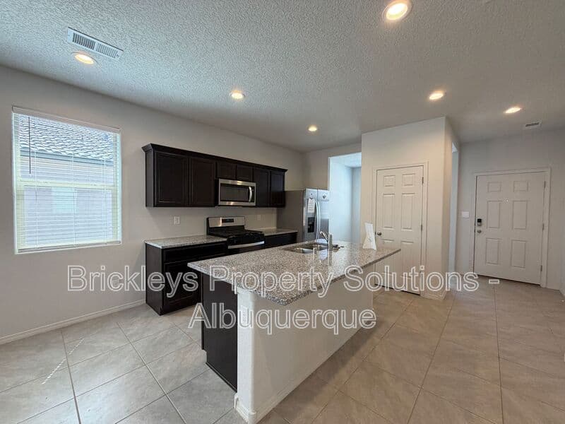 3-bedroom 2-bath home at 1504 Alto Colores for $2,100/mo managed by Brickleys Property Solutions Albuquerque — photo 7 of 30