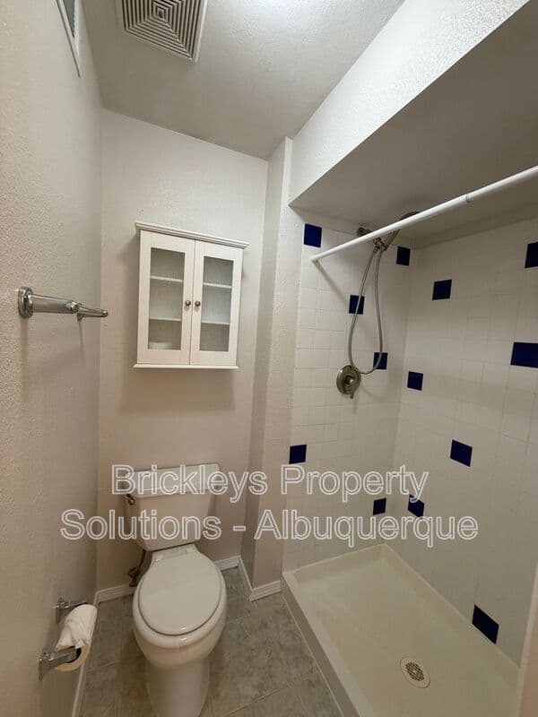 4-bedroom 2-bath home at 5812 Brahma Dr NW for $1,950/mo managed by Brickleys Property Solutions Albuquerque — photo 13 of 35