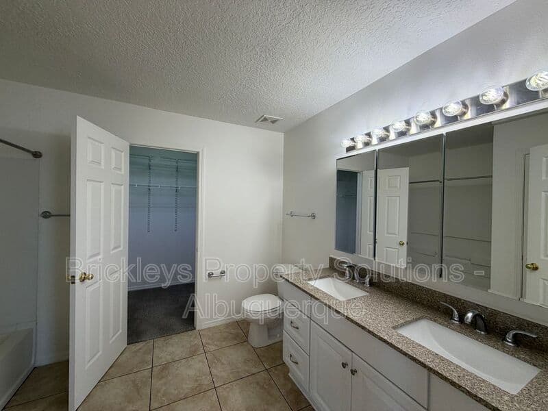 4-bedroom 3-bath home at 6027 Park South Pl NW for $2,400/mo managed by Brickleys Property Solutions Albuquerque — photo 21 of 36