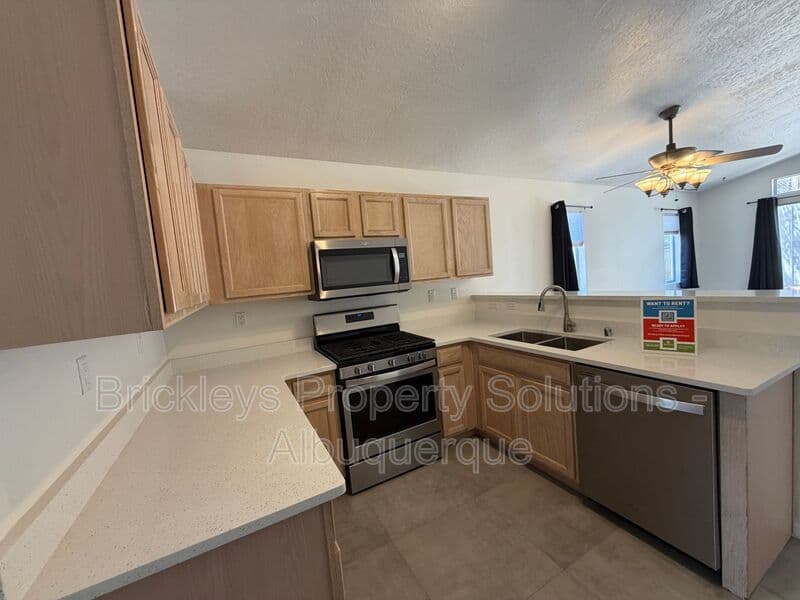 3-bedroom 2-bath home at 6019 Full Moon Ave NW for $1,900/mo managed by Brickleys Property Solutions Albuquerque — photo 6 of 26