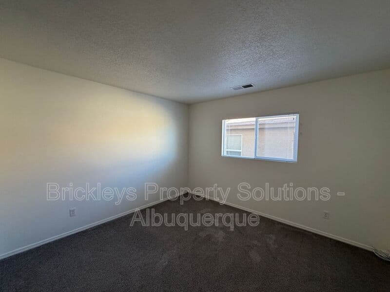 4-bedroom 3-bath home at 6027 Park South Pl NW for $2,400/mo managed by Brickleys Property Solutions Albuquerque — photo 26 of 36