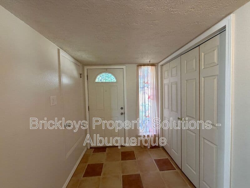 4-bedroom 2-bath home at 5812 Brahma Dr NW for $1,950/mo managed by Brickleys Property Solutions Albuquerque — photo 5 of 35