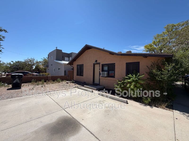 4-bedroom 2-bath home at 313 Cornell Drive SE Unit A for $1,600/mo managed by Brickleys Property Solutions Albuquerque — photo 2 of 27