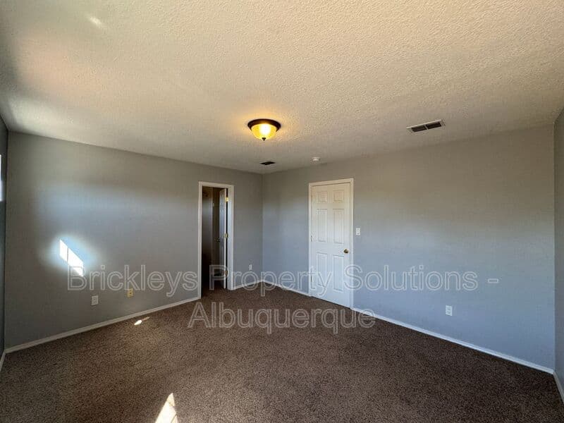 4-bedroom 3-bath home at 7131 Wild Olive Ave NE for $2,900/mo managed by Brickleys Property Solutions Albuquerque — photo 21 of 38