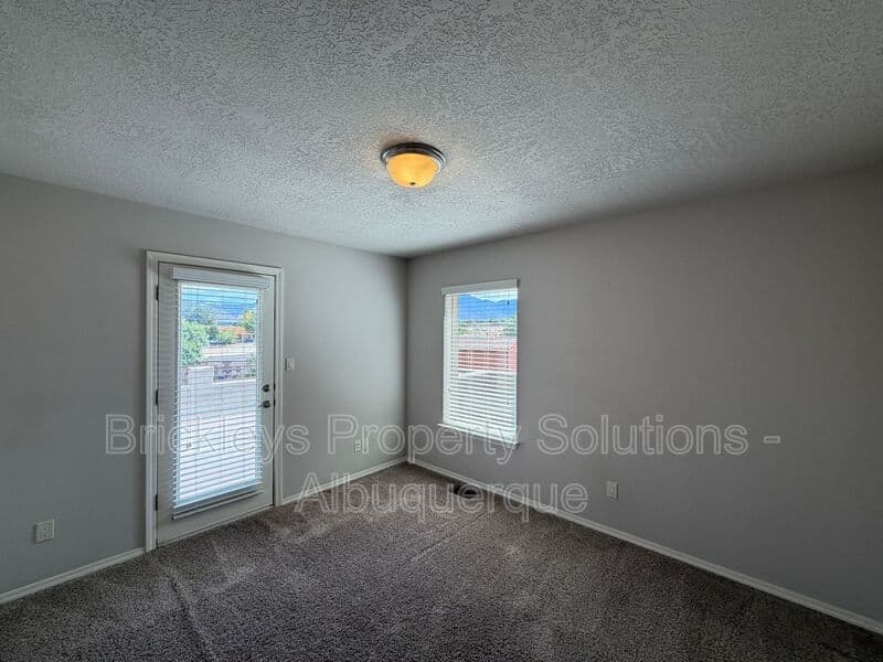 4-bedroom 2.5-bath home at 7420 Tangerine Court NE for $2,450/mo managed by Brickleys Property Solutions Albuquerque — photo 7 of 39