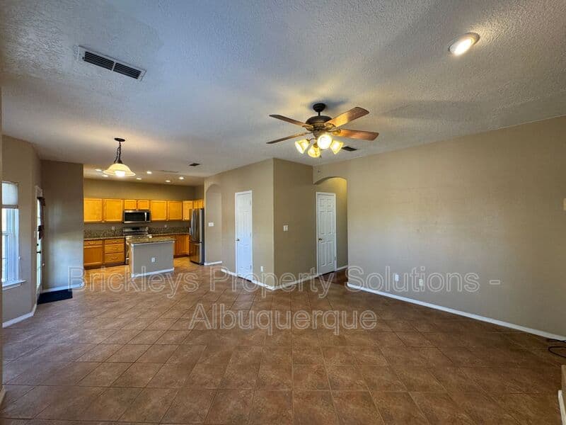 4-bedroom 3-bath home at 7131 Wild Olive Ave NE for $2,900/mo managed by Brickleys Property Solutions Albuquerque — photo 15 of 38