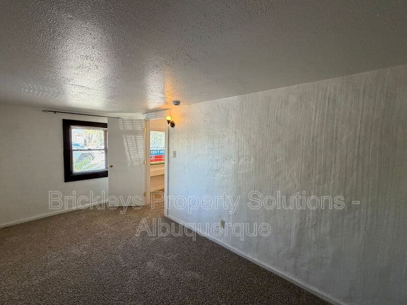 4-bedroom 2-bath home at 313 Cornell Drive SE Unit A for $1,600/mo managed by Brickleys Property Solutions Albuquerque — photo 7 of 27