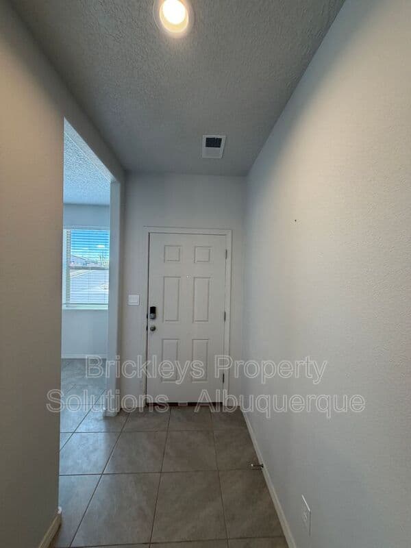 3-bedroom 2-bath home at 1504 Alto Colores for $2,100/mo managed by Brickleys Property Solutions Albuquerque — photo 4 of 30