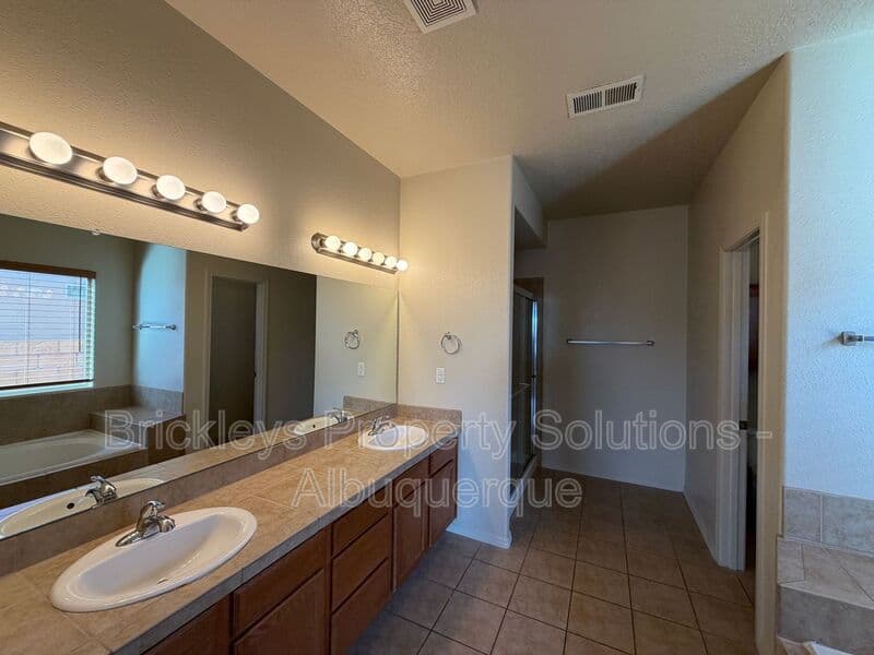 4-bedroom 3.5-bath home at 6228 Nacional Rd NW for $2,700/mo managed by Brickleys Property Solutions Albuquerque — photo 30 of 44