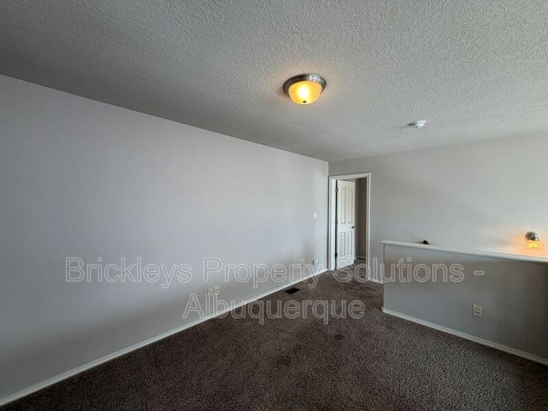 4-bedroom 2.5-bath home at 7420 Tangerine Court NE for $2,450/mo managed by Brickleys Property Solutions Albuquerque — photo 12 of 39