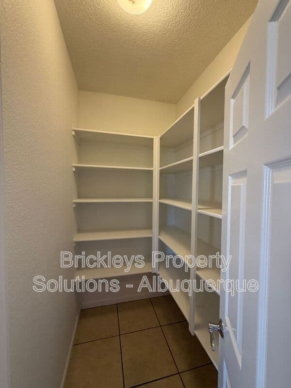3-bedroom 2.5-bath home at 418 Paseo Roja Pl NE for $2,375/mo managed by Brickleys Property Solutions Albuquerque — photo 36 of 42