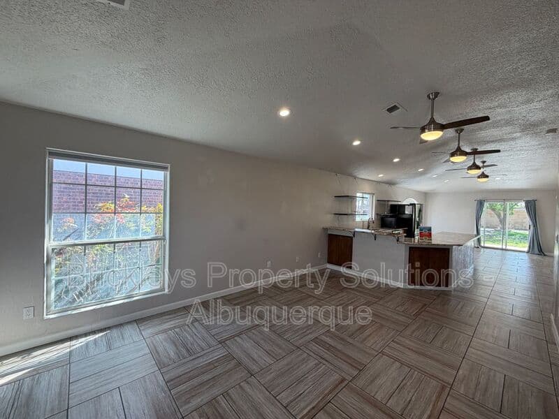 3-bedroom 2-bath home at 7024 Westford Pl NW for $2,200/mo managed by Brickleys Property Solutions Albuquerque — photo 5 of 33
