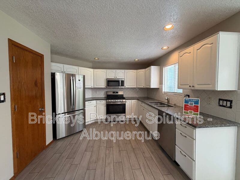 4-bedroom 2.5-bath home at 10331 Dunbar St NW for $2,300/mo managed by Brickleys Property Solutions Albuquerque — photo 25 of 43