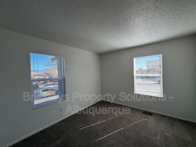 4-bedroom 3-bath home at 6027 Park South Pl NW for $2,400/mo managed by Brickleys Property Solutions Albuquerque — photo 28 of 36