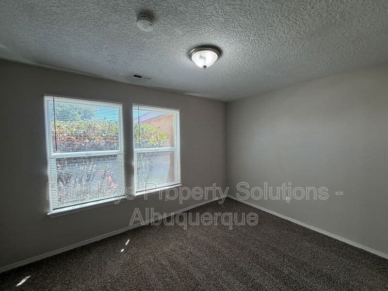 3-bedroom 2-bath home at 8035 Sierra Altos Pl. NW for $2,150/mo managed by Brickleys Property Solutions Albuquerque — photo 6 of 29