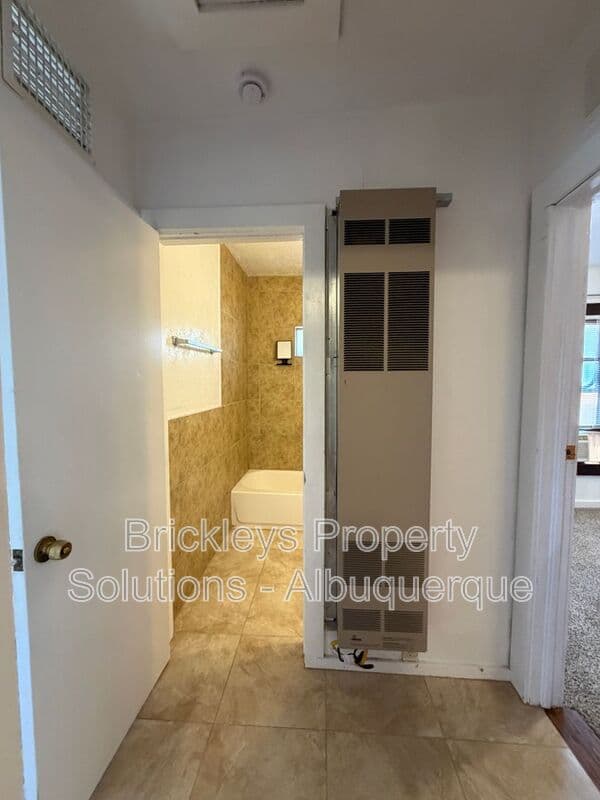 4-bedroom 2-bath home at 313 Cornell Drive SE Unit A for $1,600/mo managed by Brickleys Property Solutions Albuquerque — photo 12 of 27