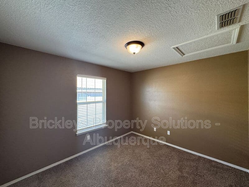 4-bedroom 3-bath home at 7131 Wild Olive Ave NE for $2,900/mo managed by Brickleys Property Solutions Albuquerque — photo 24 of 38