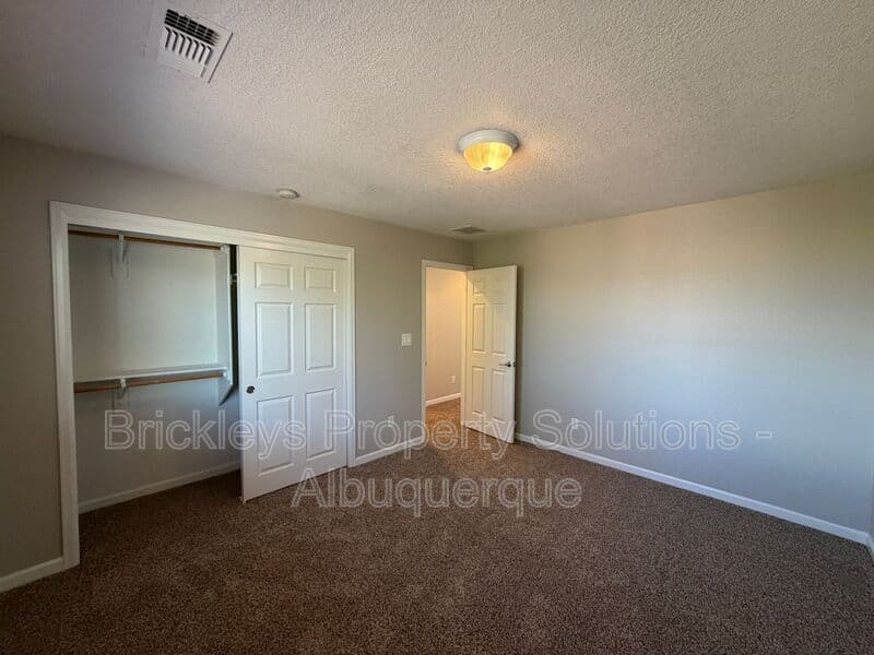 3-bedroom 2.5-bath home at 418 Paseo Roja Pl NE for $2,375/mo managed by Brickleys Property Solutions Albuquerque — photo 10 of 42