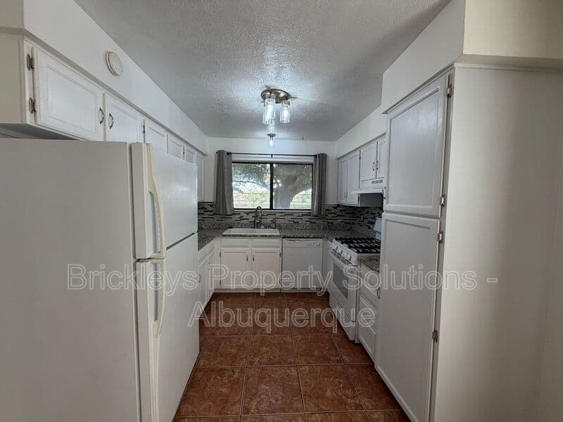 4-bedroom 2-bath home at 5812 Brahma Dr NW for $1,950/mo managed by Brickleys Property Solutions Albuquerque — photo 28 of 35