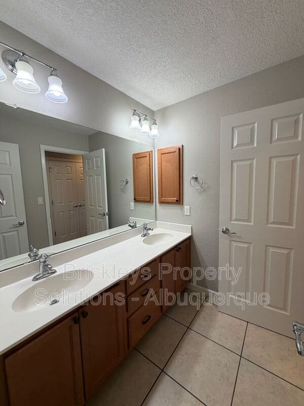 3-bedroom 2.5-bath home at 418 Paseo Roja Pl NE for $2,375/mo managed by Brickleys Property Solutions Albuquerque — photo 17 of 42