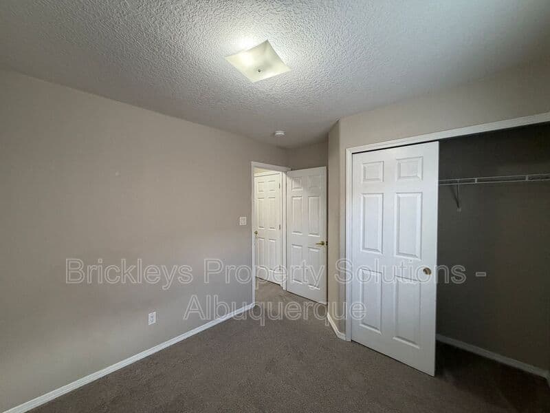 5-bedroom 4.5-bath home at 7008 Tree Line Ave NW for $2,500/mo managed by Brickleys Property Solutions Albuquerque — photo 15 of 43