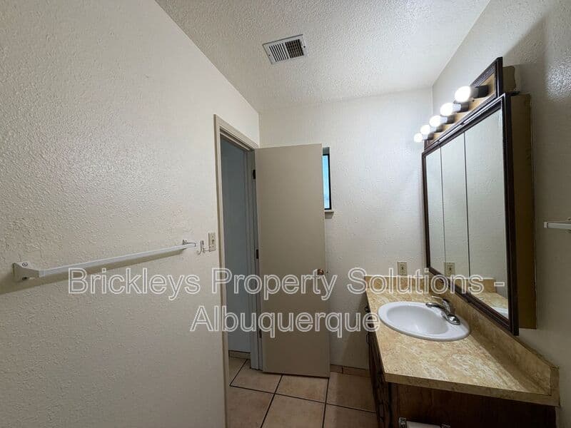 3-bedroom 2-bath home at 9937 Clearwater St. NW for $1,900/mo managed by Brickleys Property Solutions Albuquerque — photo 13 of 27