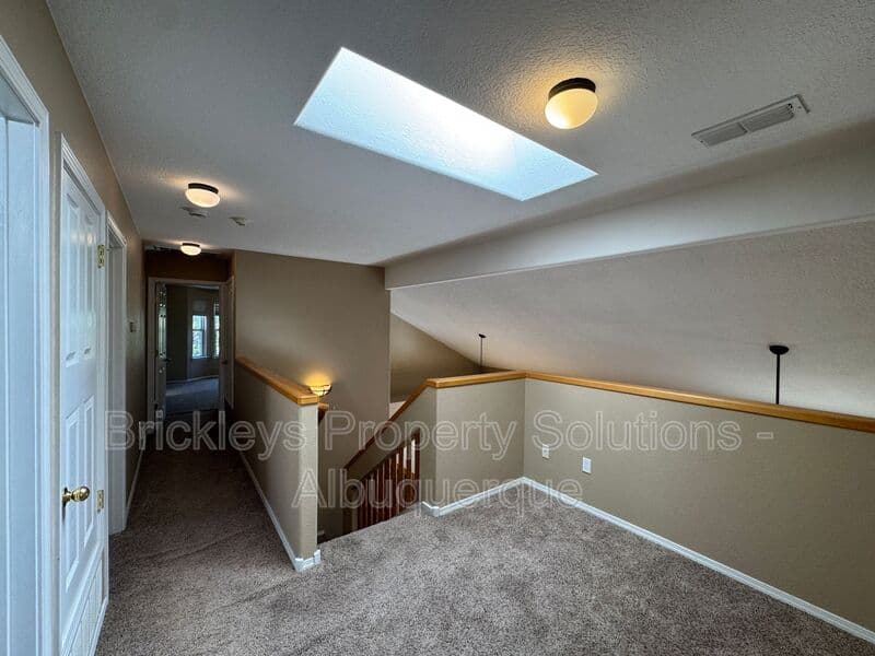 4-bedroom 3-bath home at 7131 Wild Olive Ave NE for $2,900/mo managed by Brickleys Property Solutions Albuquerque — photo 19 of 38