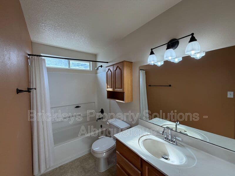 3-bedroom 2-bath home at 7704 Woodstar Ave NW for $1,825/mo managed by Brickleys Property Solutions Albuquerque — photo 15 of 28