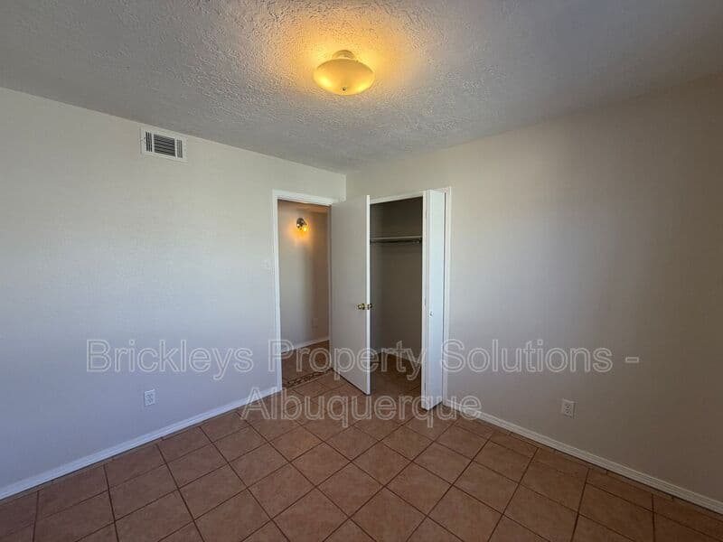4-bedroom 2-bath home at 5812 Brahma Dr NW for $1,950/mo managed by Brickleys Property Solutions Albuquerque — photo 18 of 35