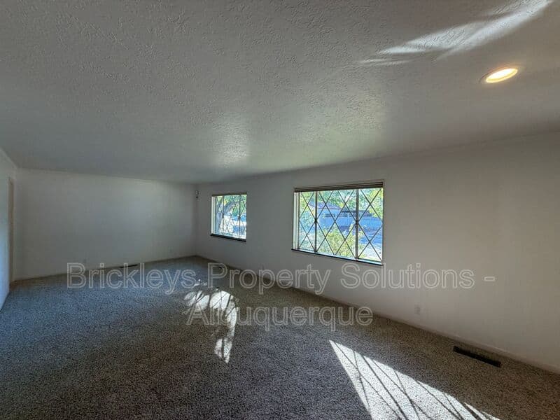4-bedroom 3-bath home at 7121 Edwina Ave NE for $2,450/mo managed by Brickleys Property Solutions Albuquerque — photo 7 of 47