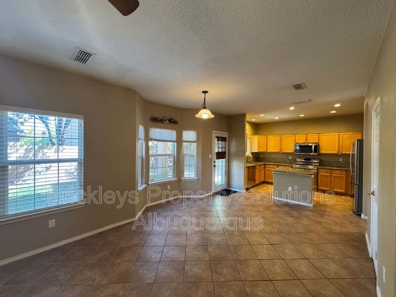 4-bedroom 3-bath home at 7131 Wild Olive Ave NE for $2,900/mo managed by Brickleys Property Solutions Albuquerque — photo 11 of 38