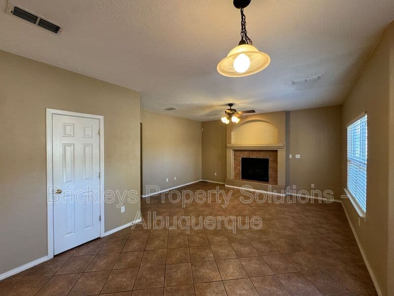 4-bedroom 3-bath home at 7131 Wild Olive Ave NE for $2,900/mo managed by Brickleys Property Solutions Albuquerque — photo 12 of 38