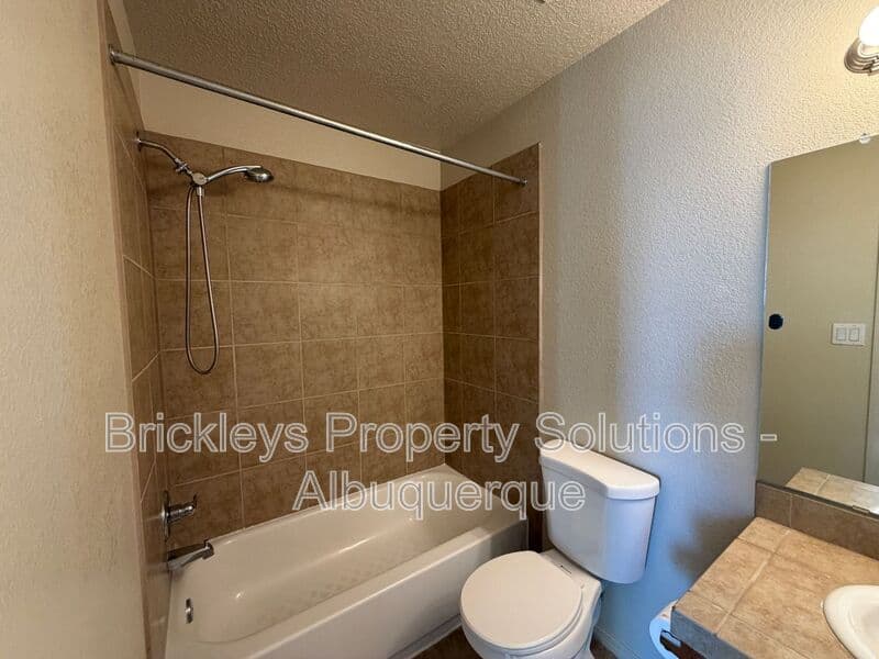 4-bedroom 3.5-bath home at 6228 Nacional Rd NW for $2,700/mo managed by Brickleys Property Solutions Albuquerque — photo 15 of 44