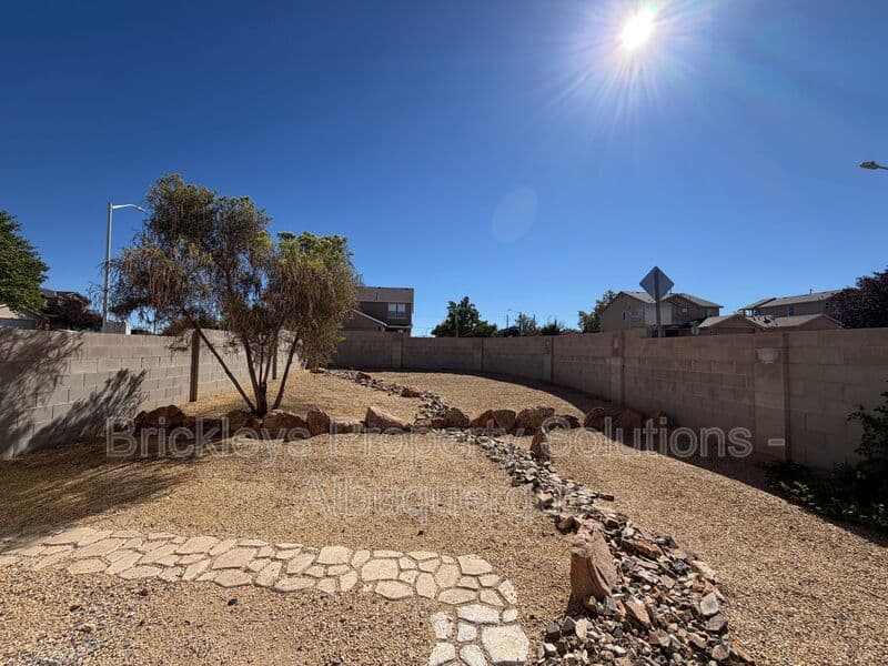 4-bedroom 3-bath home at 6027 Park South Pl NW for $2,400/mo managed by Brickleys Property Solutions Albuquerque — photo 4 of 36