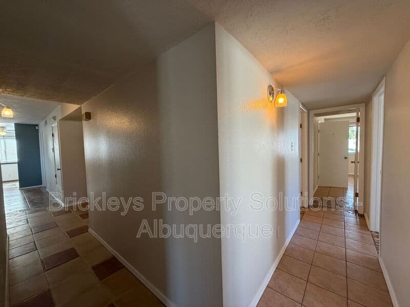 4-bedroom 2-bath home at 5812 Brahma Dr NW for $1,950/mo managed by Brickleys Property Solutions Albuquerque — photo 11 of 35