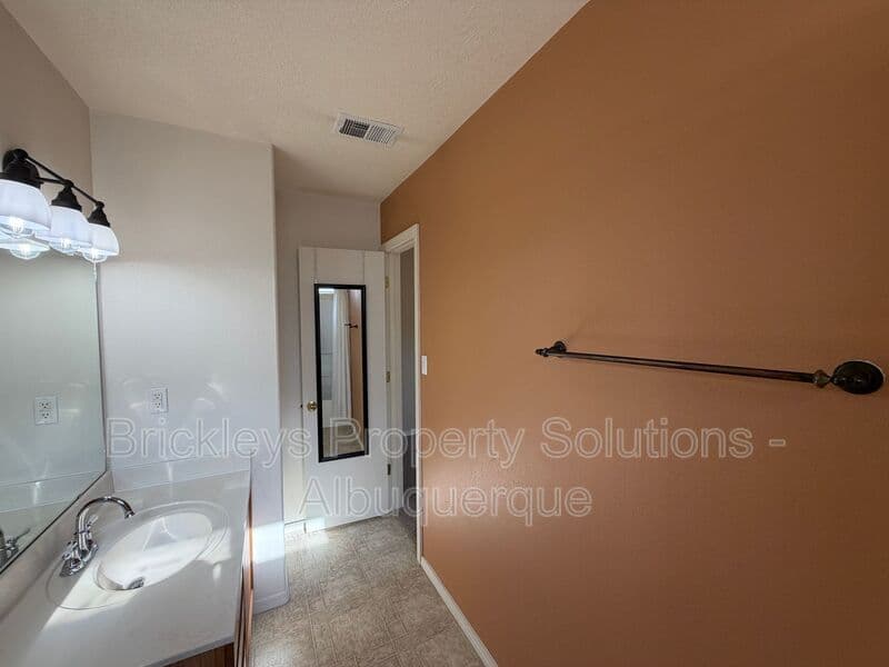 3-bedroom 2-bath home at 7704 Woodstar Ave NW for $1,825/mo managed by Brickleys Property Solutions Albuquerque — photo 16 of 28