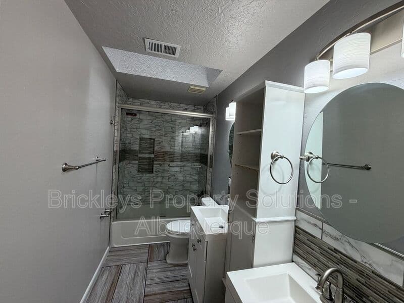 3-bedroom 2-bath home at 7024 Westford Pl NW for $2,200/mo managed by Brickleys Property Solutions Albuquerque — photo 12 of 33