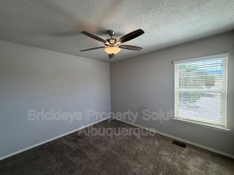 4-bedroom 2.5-bath home at 7420 Tangerine Court NE for $2,450/mo managed by Brickleys Property Solutions Albuquerque — photo 18 of 39