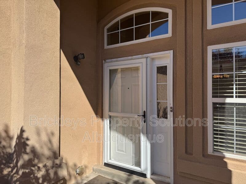 4-bedroom 3-bath home at 7131 Wild Olive Ave NE for $2,900/mo managed by Brickleys Property Solutions Albuquerque — photo 4 of 38