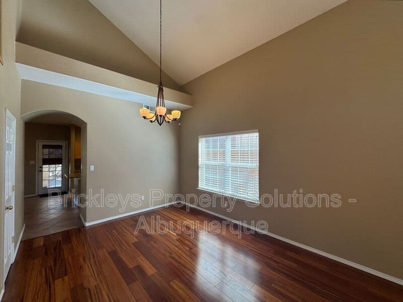 4-bedroom 3-bath home at 7131 Wild Olive Ave NE for $2,900/mo managed by Brickleys Property Solutions Albuquerque — photo 8 of 38