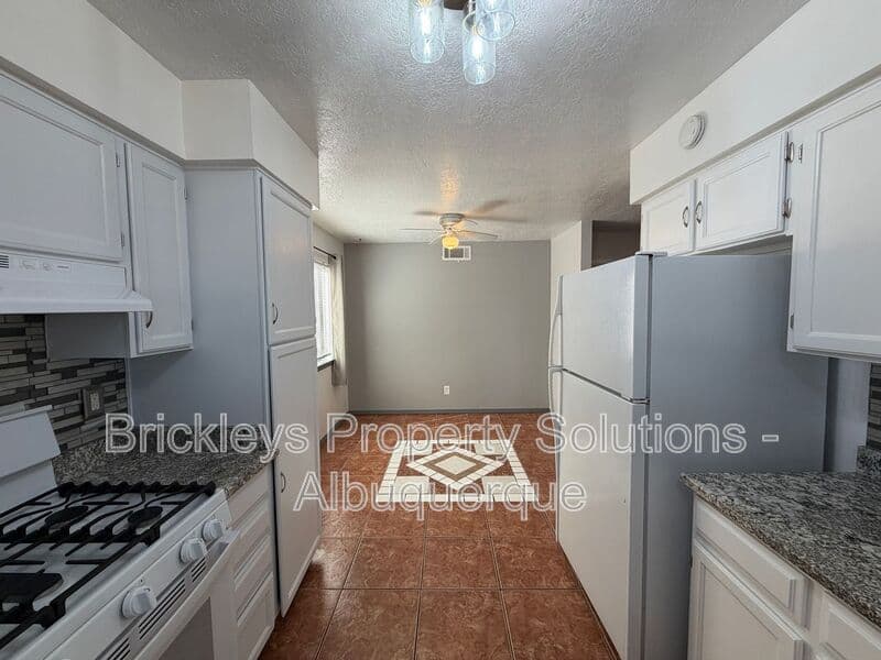 4-bedroom 2-bath home at 5812 Brahma Dr NW for $1,950/mo managed by Brickleys Property Solutions Albuquerque — photo 29 of 35