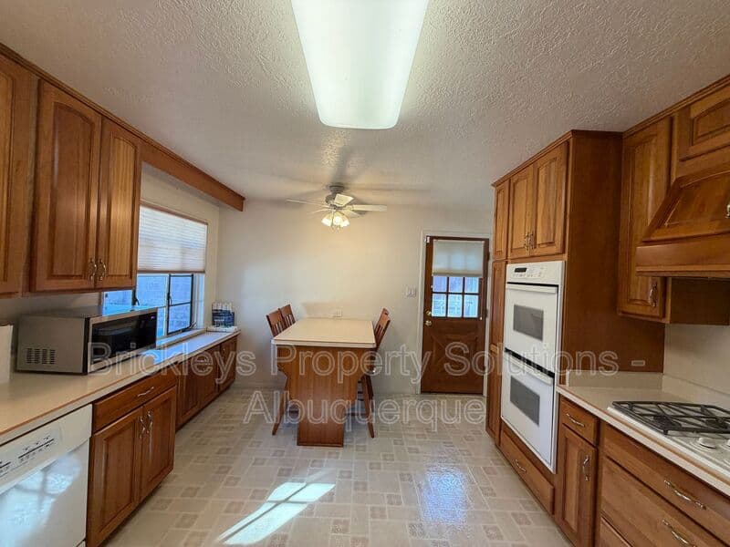 4-bedroom 3-bath home at 7121 Edwina Ave NE for $2,450/mo managed by Brickleys Property Solutions Albuquerque — photo 13 of 47