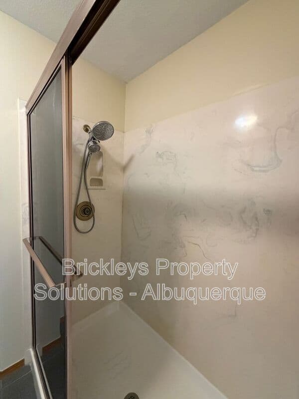 3-bedroom 2.5-bath home at 9600 Allande Rd NE for $3,200/mo managed by Brickleys Property Solutions Albuquerque — photo 32 of 40