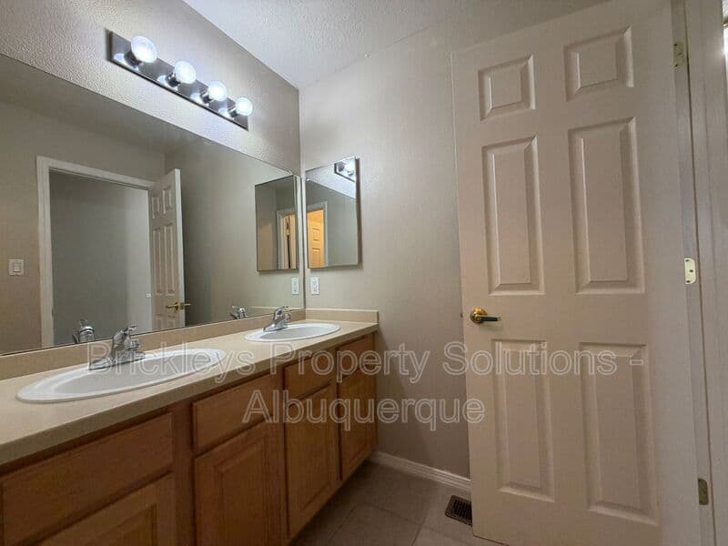 5-bedroom 4.5-bath home at 7008 Tree Line Ave NW for $2,500/mo managed by Brickleys Property Solutions Albuquerque — photo 23 of 43