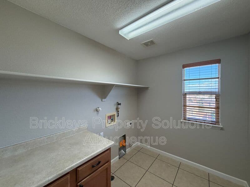 3-bedroom 2.5-bath home at 418 Paseo Roja Pl NE for $2,375/mo managed by Brickleys Property Solutions Albuquerque — photo 12 of 42