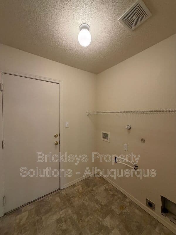 3-bedroom 2-bath home at 7704 Woodstar Ave NW for $1,825/mo managed by Brickleys Property Solutions Albuquerque — photo 23 of 28